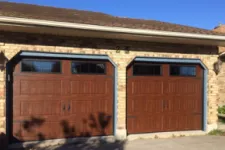 House with wooden garage doors