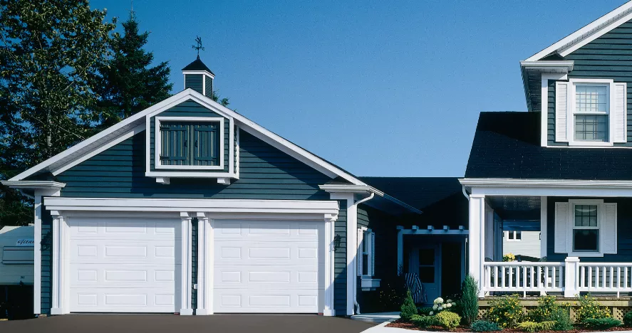 Traditional House with 2 White Garage Doors